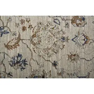 Photo of 12' Blue Gray and Brown Floral Power Loom Worn Faded Runner Rug With Fringe