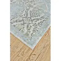 Photo of 8' Blue Gray and Green Floral Power Loom Worn Faded Runner Rug