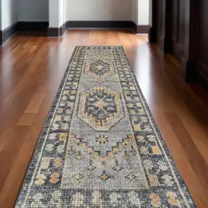 Photo of 14' Blue Gray and Tan Wool Oriental Hand Knotted Runner Rug With Fringe