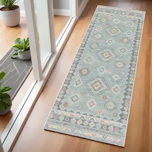 Photo of 6' Blue Light Blue and Orange Geometric Flatweave Runner Rug