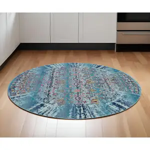 Photo of 6' Blue Red And Orange Floral Distressed Round Rug