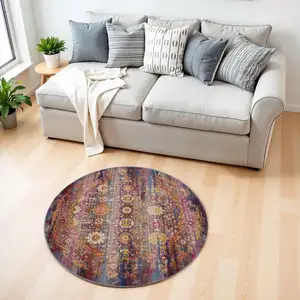 Photo of 4' Blue Yellow And Red Floral Distressed Round Rug