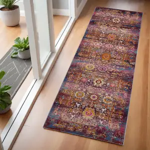 Photo of 6' Blue Yellow And Red Floral Distressed Runner Rug