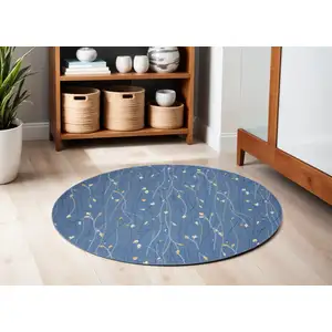 Photo of 4' Blue and Beige Round Floral Vines Power Loom Area Rug