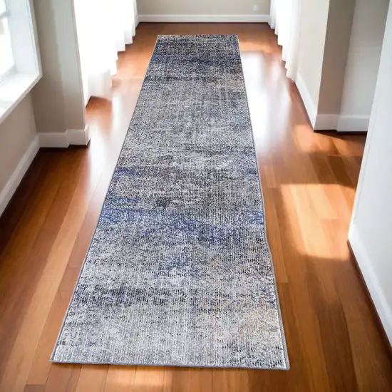 10' Blue and Ivory Abstract Power Loom Distressed Runner Rug Photo 1