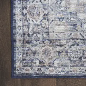 Photo of 8' Blue and Ivory Floral Power Loom Distressed Washable Runner Rug