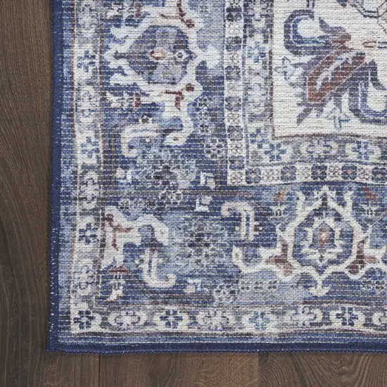 8' Blue and Ivory Floral Power Loom Distressed Washable Runner Rug Photo 1