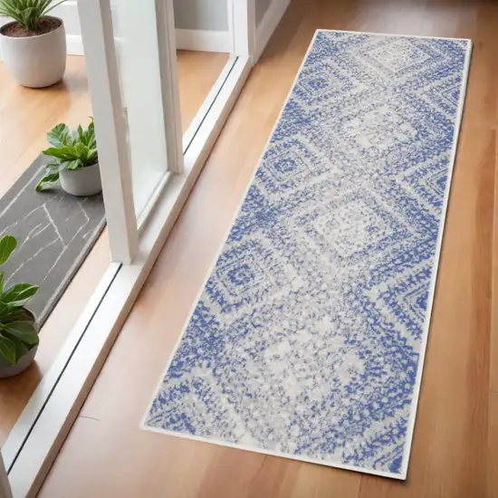 6' Blue and Ivory Geometric Distressed Runner Rug Photo 1