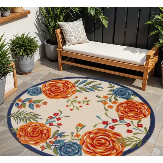 8' Ivory Orange and Blue Round Floral Indoor Outdoor Area Rug Photo 1