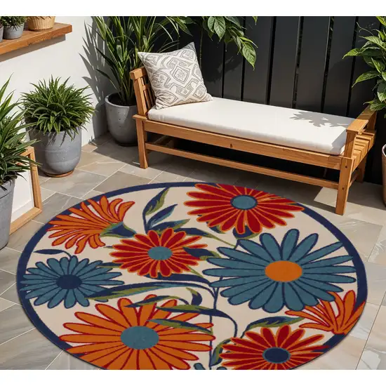 8' Ivory Orange and Blue Round Floral Indoor Outdoor Area Rug Photo 1