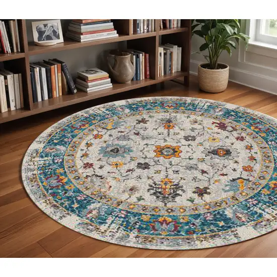 7' Blue and Orange Floral Power Loom Round Rug Photo 1