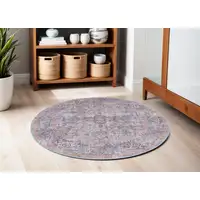 Photo of 5' Blue and Purple Round Floral Power Loom Distressed Area Rug