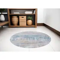 Photo of 5' Blue and Yellow Round Abstract Non Skid Area Rug
