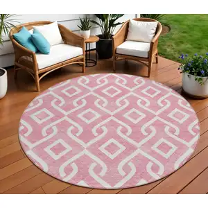 Photo of 8' Blush And Ivory Round Geometric Washable Indoor Outdoor Area Rug