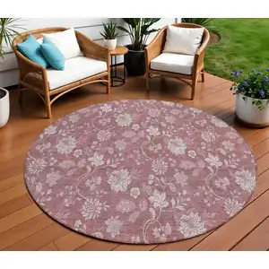 Photo of 8' Blush Pink And Mauve Round Floral Washable Indoor Outdoor Area Rug