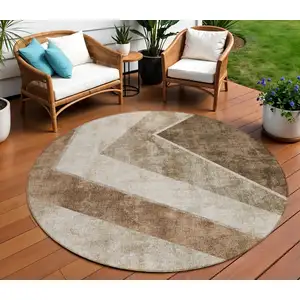 Photo of 8' Brown And Beige Round Geometric Washable Indoor Outdoor Area Rug