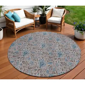 Photo of 8' Brown And Blue Round Floral Washable Indoor Outdoor Area Rug