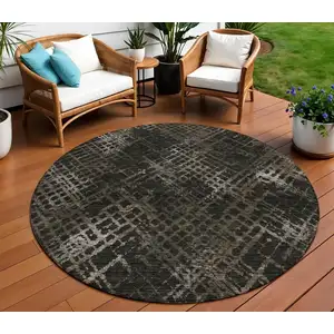 Photo of 8' Brown And Chocolate Round Geometric Washable Indoor Outdoor Area Rug