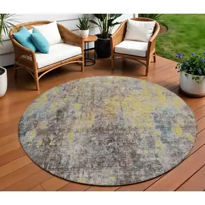 Photo of 8' Brown And Gold Round Abstract Washable Indoor Outdoor Area Rug