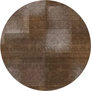 Photo of 8' Brown And Ivory Round Abstract Washable Indoor Outdoor Area Rug