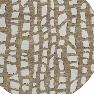 Photo of 8' Brown And Ivory Round Abstract Washable Indoor Outdoor Area Rug