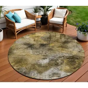 Photo of 8' Brown Beige And Gold Round Abstract Washable Indoor Outdoor Area Rug