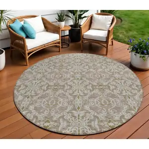 Photo of 8' Brown Beige And Taupe Round Medallion Washable Indoor Outdoor Area Rug