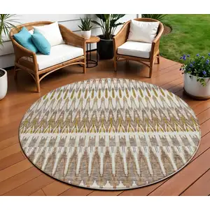 Photo of 8' Brown Beige And Taupe Round Southwestern Washable Indoor Outdoor Area Rug