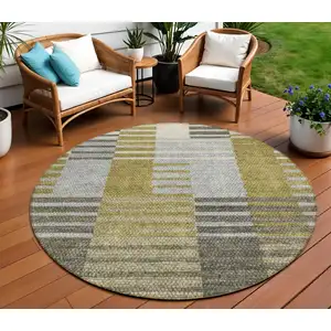 Photo of 8' Brown Gold And Taupe Round Striped Washable Indoor Outdoor Area Rug