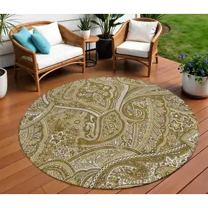 Photo of 8' Brown Tan And Beige Round Paisley Washable Indoor Outdoor Area Rug