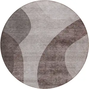 Photo of 8' Brown Taupe And Beige Round Abstract Washable Indoor Outdoor Area Rug