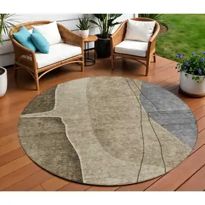 Photo of 8' Brown Taupe And Beige Round Abstract Washable Indoor Outdoor Area Rug