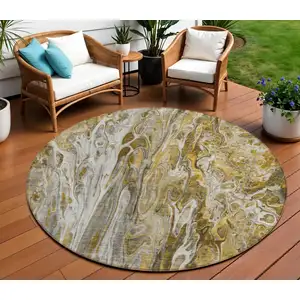 Photo of 8' Brown Taupe And Gold Round Abstract Washable Indoor Outdoor Area Rug