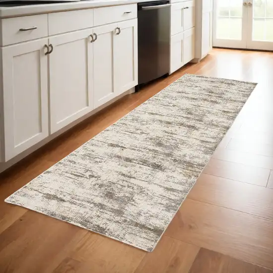 8' Brown and Ivory Abstract Distressed Runner Rug Photo 1