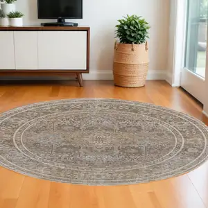 Photo of 8' Brown and Ivory Round Medallion Power Loom Distressed Area Rug