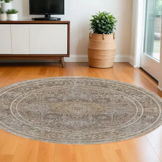 8' Brown and Ivory Round Medallion Power Loom Distressed Area Rug Photo 1