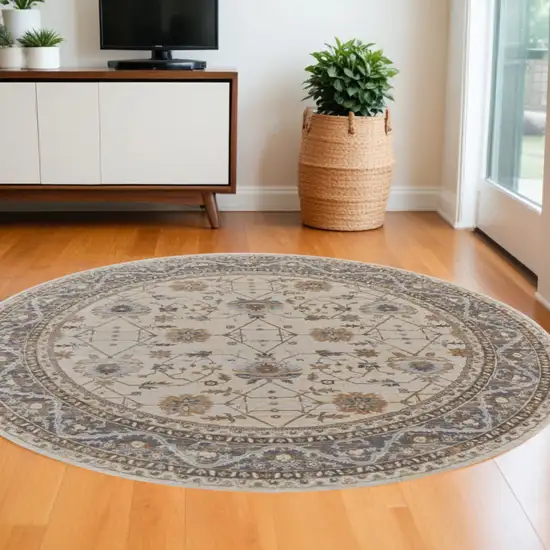 8' Brown and Ivory Round Oriental Power Loom Distressed Area Rug Photo 1