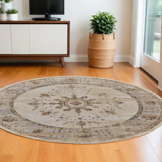 8' Brown and Ivory Round Oriental Power Loom Distressed Area Rug Photo 1