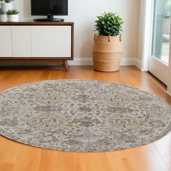 8' Brown and Ivory Round Oriental Power Loom Distressed Area Rug Photo 1