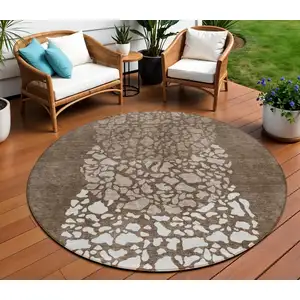 Photo of 8' Chocolate And Taupe Round Abstract Washable Indoor Outdoor Area Rug