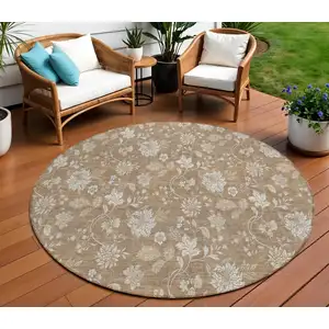 Photo of 8' Copper And Beige Round Floral Washable Indoor Outdoor Area Rug