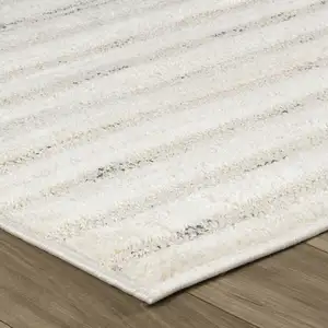 Photo of 8' Cream and Beige Abstract Distressed Area Rug