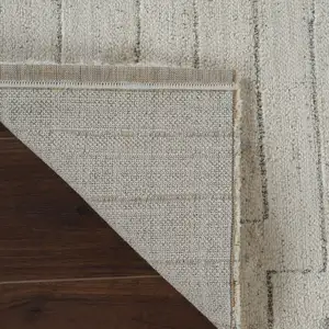 Photo of 8' Cream and Beige Abstract Distressed Area Rug