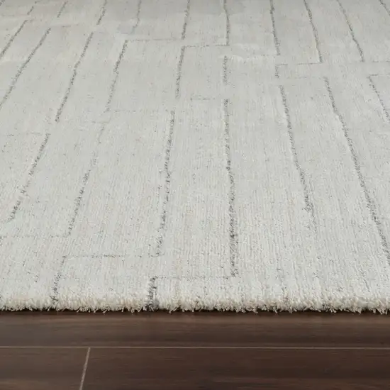 8' Cream and Beige Abstract Distressed Area Rug Photo 7