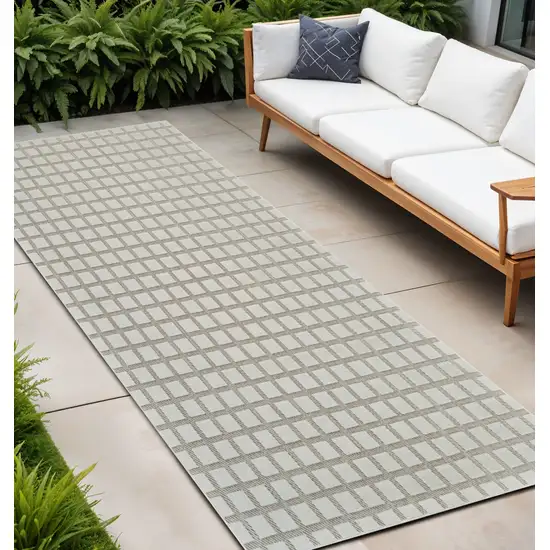 10' Cream and Beige Geometric Distressed Indoor Outdoor Runner Rug Photo 1