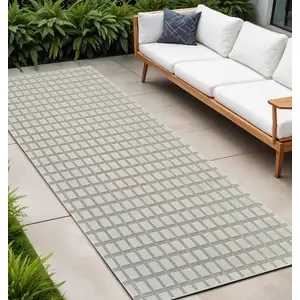 Photo of 10' Cream and Beige Geometric Distressed Indoor Outdoor Runner Rug