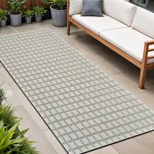 Photo of 8' Cream and Beige Geometric Distressed Indoor Outdoor Runner Rug