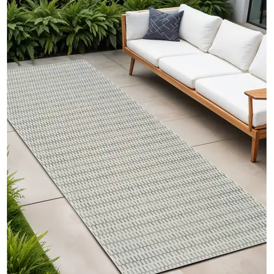 10' Cream and Beige Geometric Distressed Indoor Outdoor Runner Rug Photo 1