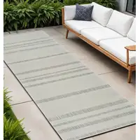 Photo of 10' Cream and Beige Striped Distressed Indoor Outdoor Runner Rug