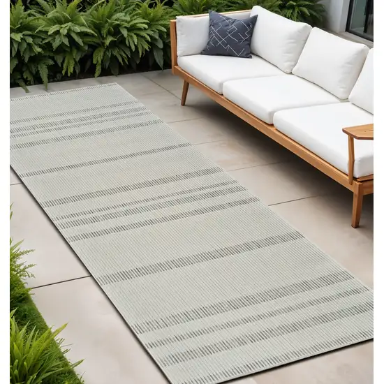 10' Cream and Beige Striped Distressed Indoor Outdoor Runner Rug Photo 1